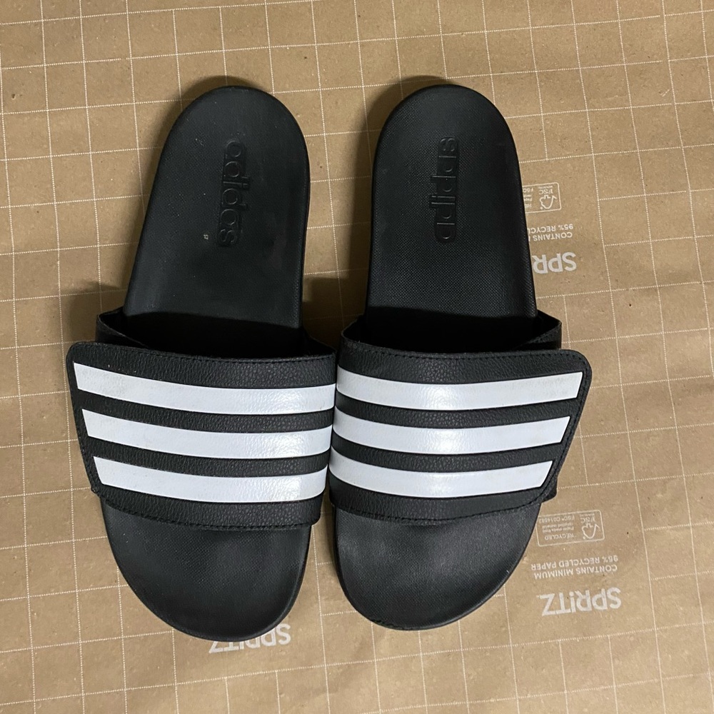 Black adidas striped slides